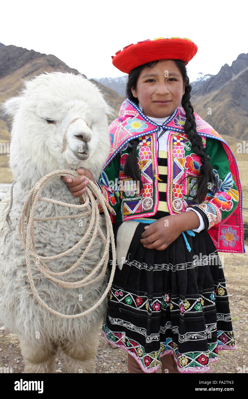 andean-girl-wearing-traditional-clothes-with-an-alpaca-FA2TN3.jpg
